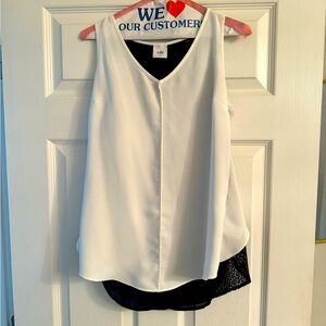 Super cute Cabi top. Black detail in back. Good at hiding muffin top 🥴